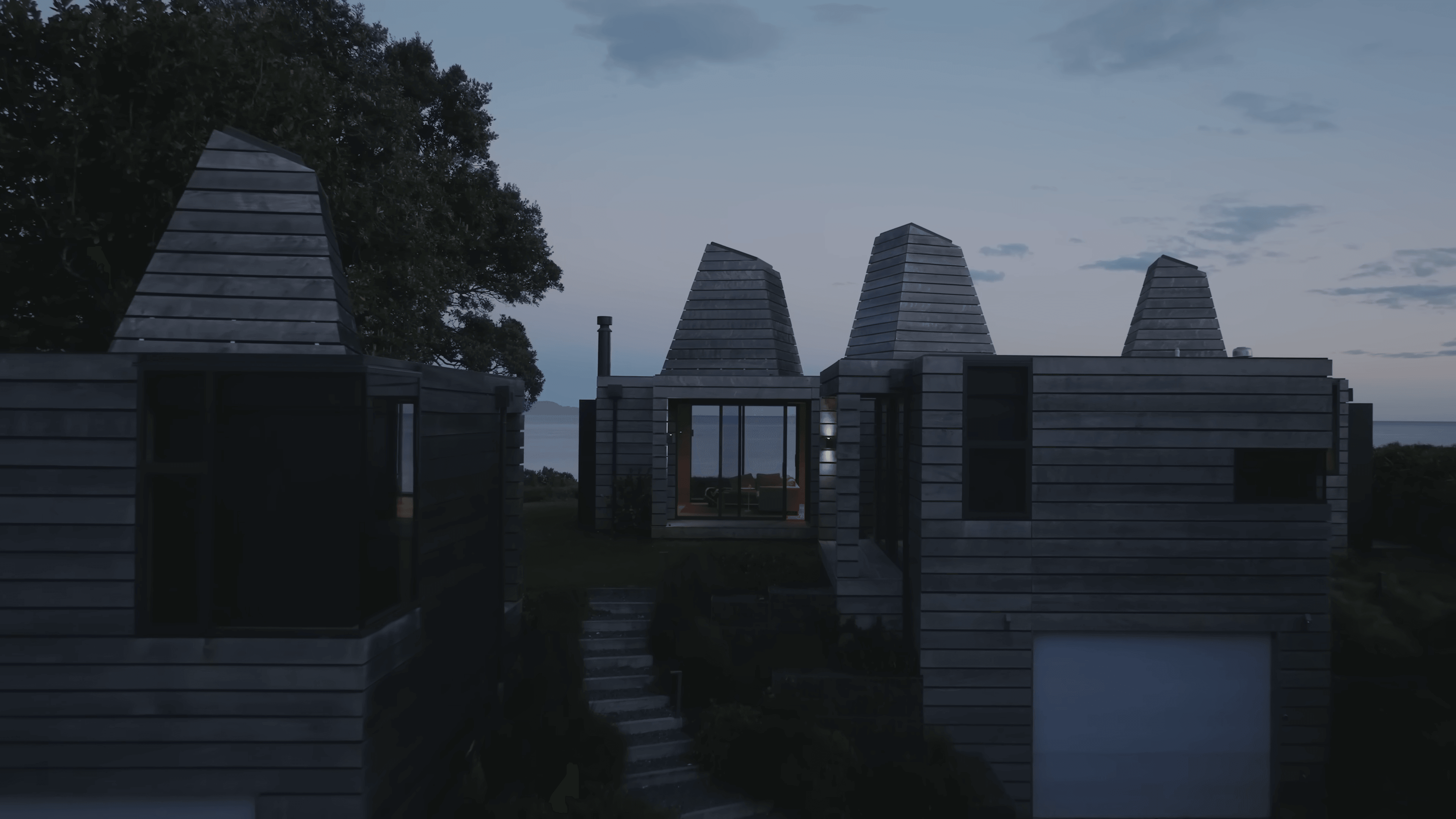 The Kilns — exterior at dusk with the water visible beyond