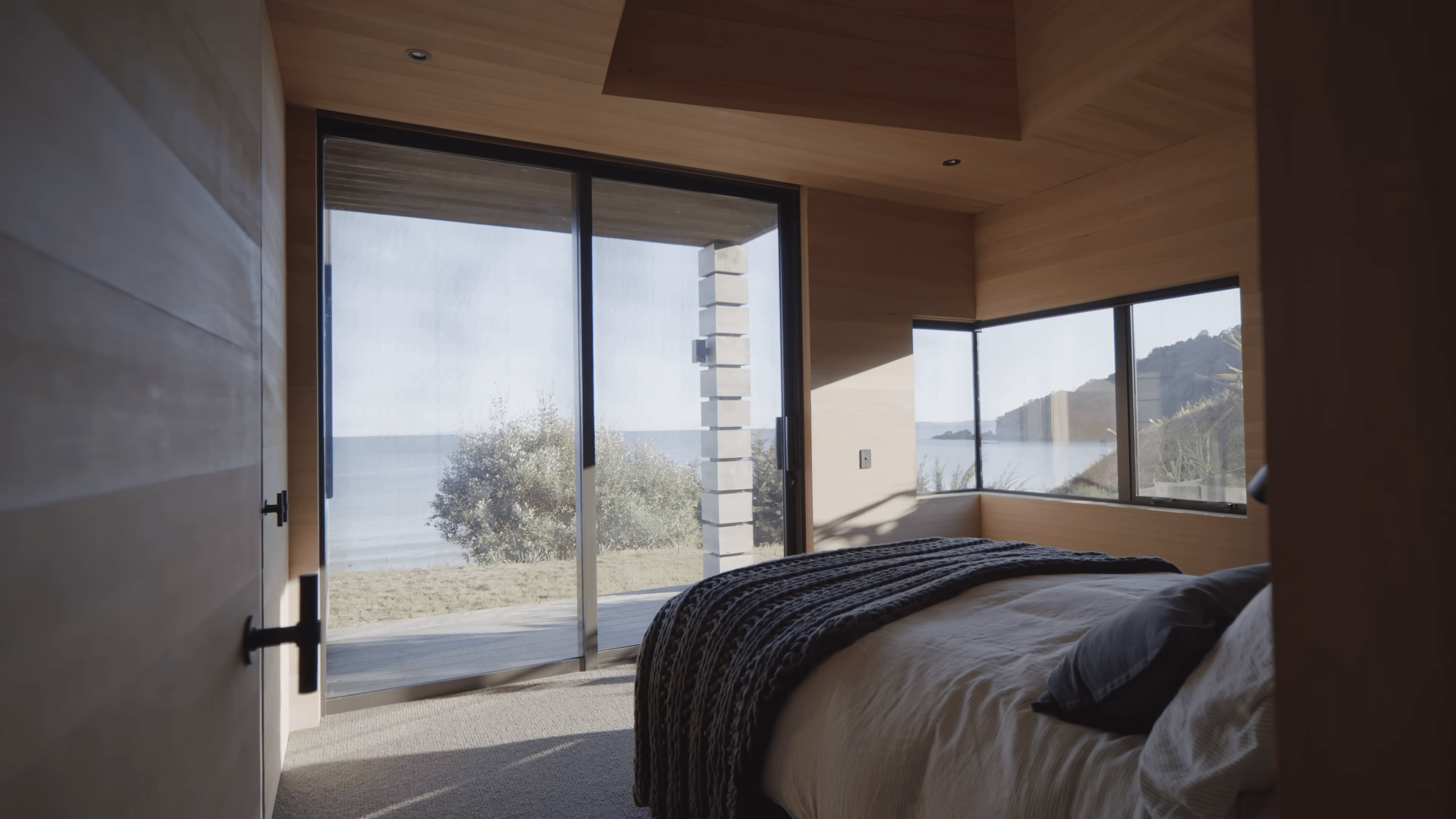 The Kilns — bedroom opening directly onto the water